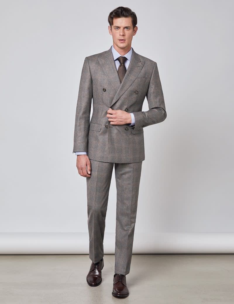 Model wearing a grey wool Prince of Wales double breasted suit