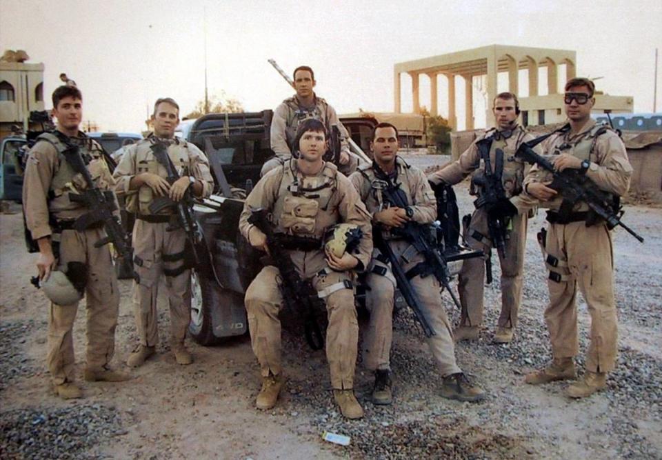 Staff Sgt. Paul Mardis Jr., second from right, is pictured with his unit in Iraq. Mardis, a graduate of Palmetto High School, died July 15, 2004, from complications as a result of injuries sustained in Iraq.