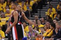 May 1, 2016; Oakland, CA, USA; Portland Trail Blazers guard Gerald Henderson (9, left back) argues with Golden State Warriors forward Anderson Varejao (18) during the third quarter in game one of the second round of the NBA Playoffs at Oracle Arena. Kyle Terada-USA TODAY Sports