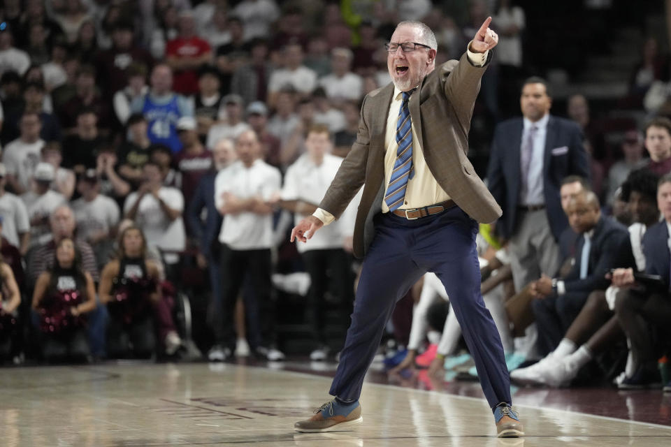 Texas A&M head coach Buzz Williams yells to his defense as they setup against Oral Roberts during the second half of an NCAA college basketball game Friday, Nov. 17, 2023, in College Station, Texas. (AP Photo/Sam Craft)
