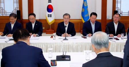 South Korean President Moon Jae-in speaks during a meeting with executives from South Korea's top 30 conglomerates at the Presidential Blue House in Seoul