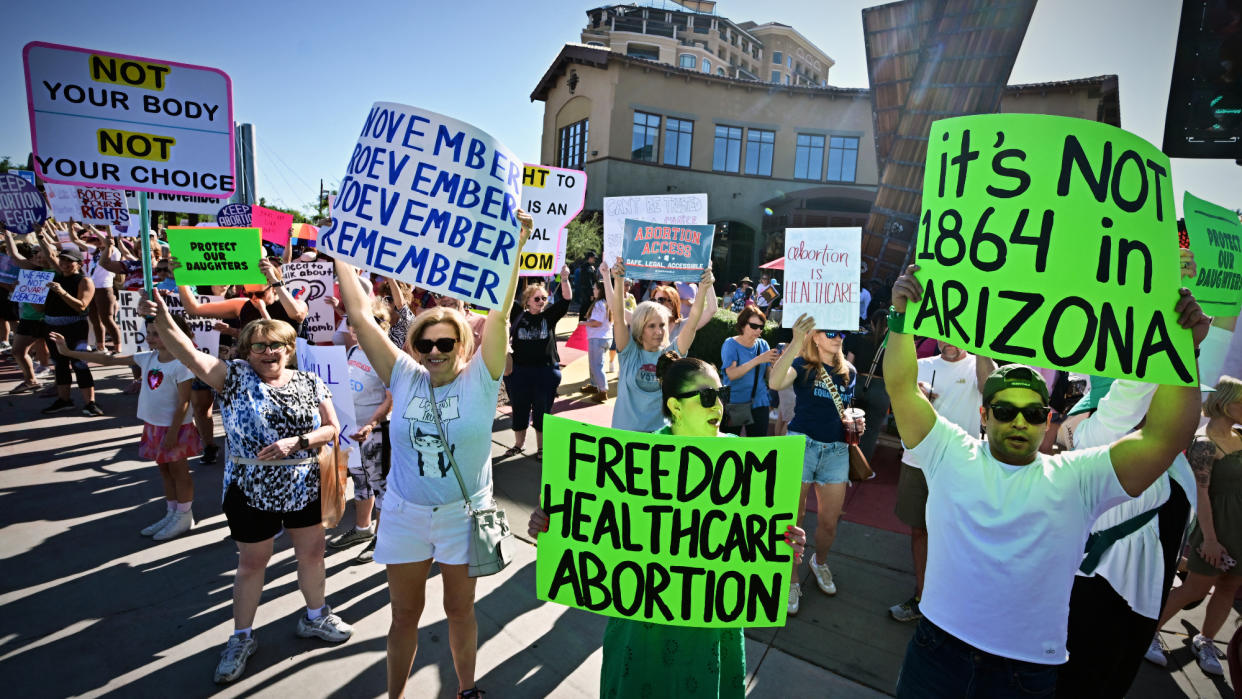  Abortion rights rally in Arizona with hand-drawn signs. 
