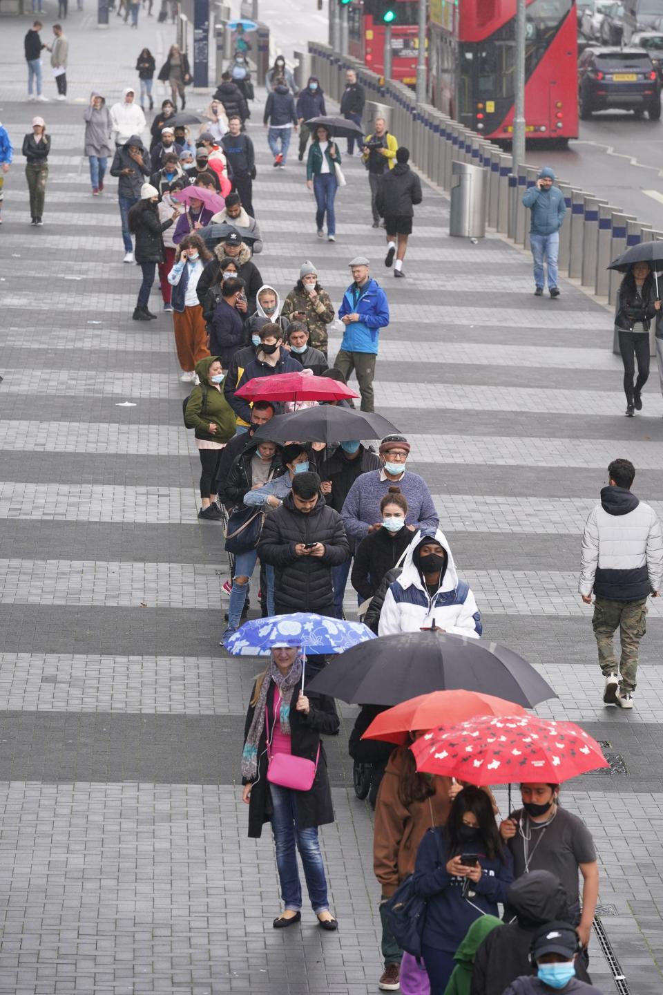 There were huge queues outside the Tottenham Hotspur stadium on Sunday (PA)