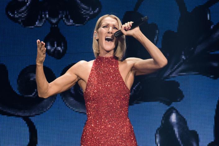 celine dion singing in red sparkly halter neck dress, Canadian singer Celine Dion performs on the opening night of her new world tour 