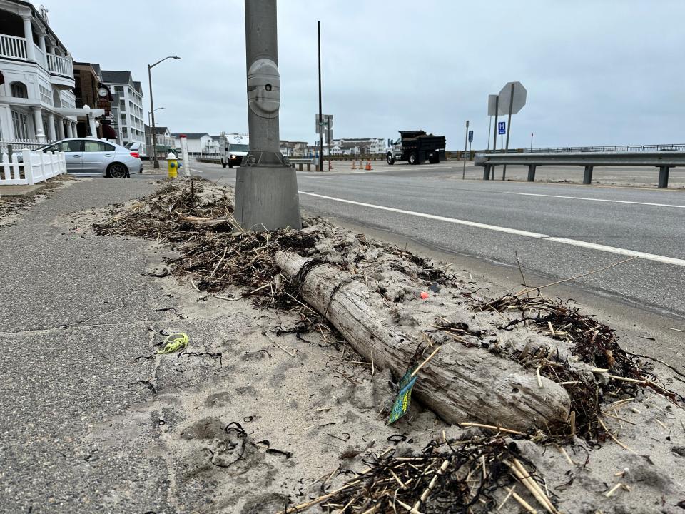 Debris from the ocean remains on the sidewalks west of Ocean Boulevard after a winter of harsh storms. Town officials say they are collaborating with the state to make sure they're cleaned up despite an ongoing dispute over who is responsible for the sidewalks.