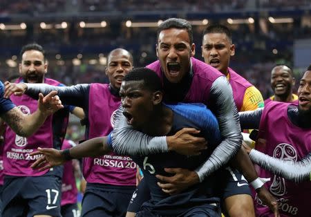 Soccer Football - World Cup - Final - France v Croatia - Luzhniki Stadium, Moscow, Russia - July 15, 2018 France's Paul Pogba celebrates scoring their third goal with Corentin Tolisso and team mates REUTERS/Carl Recine