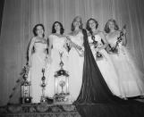 <p>Colleen Hutchins from Utah, center, is pictured next to the runners-up following her win. Her white off-the-shoulder gown is fit for a bride.</p>