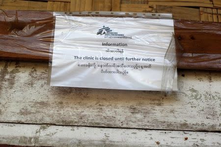 A sign is seen outside a Medecins Sans Frontieres (MSF) clinic in a village at Maungdaw June 6, 2014. REUTERS/Soe Zeya Tun