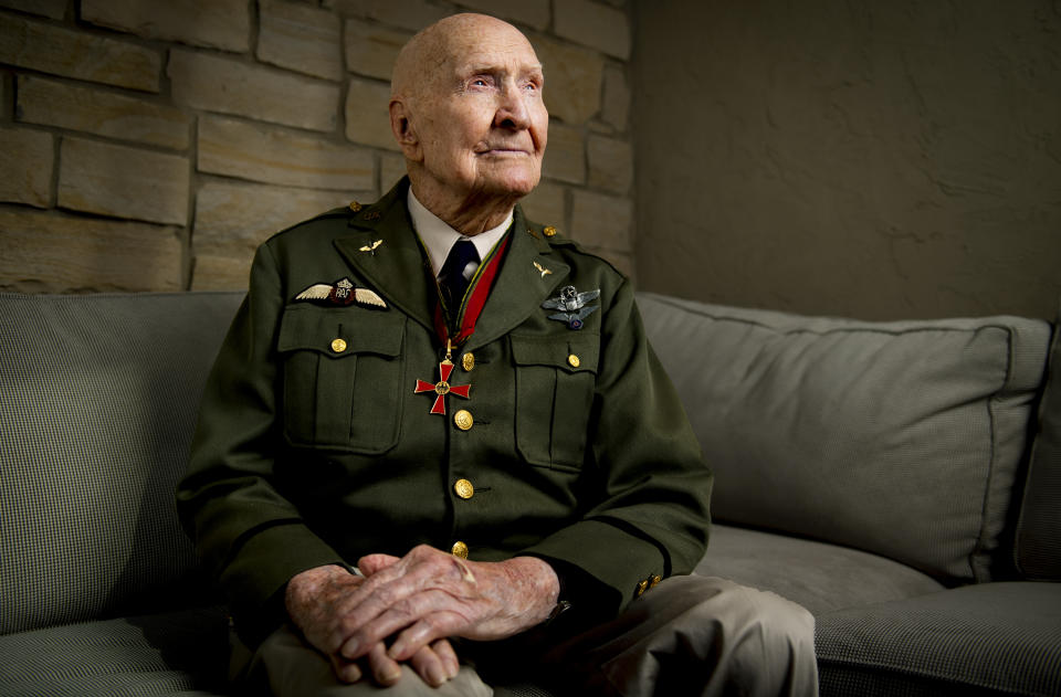 FILE - Gail Halvorsen, also know as the "Candy Bomber", poses for a portrait at his son's home in Midway, Utah, on Oct. 7, 2020. The man known as the "Candy Bomber" for his airdrops of sweets during the Berlin Airlift when World War II ended nearly 75 years ago has died. Gail Halvorsen was 101 when he died Wednesday, Feb. 16, 2022, in his home state of Utah surrounded by most of his children after a brief illness, James Stewart, the director of the Gail Halvorsen Aviation Education Foundation, said Thursday. (Isaac Hale/The Daily Herald via AP)