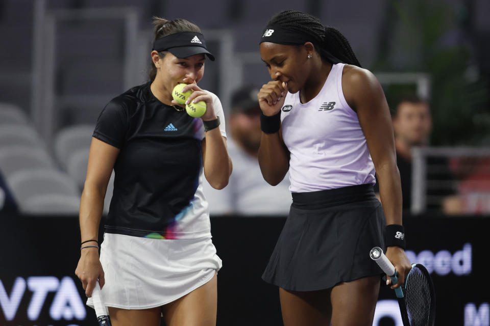 Jessica Pegula, left, talks with Coco Gauff, right, during their doubles match against Yifan Xu and Zhaoxuan Yang in the WTA Finals tennis tournament in Fort Worth, Texas, Monday, Oct. 31, 2022. (AP Photo/Tim Heitman)