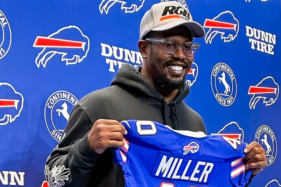 FILE - Von Miller holds up a Buffalo Bills jersey during a news conference March 17, 2022, in Orchard Park, N.Y. Upgrading Buffalo's middling pass rush with Miller's imposing presence should theoretically take the pressure off the secondary from having to hold up in coverage. (AP Photo/Mark Ludwiczak, File)