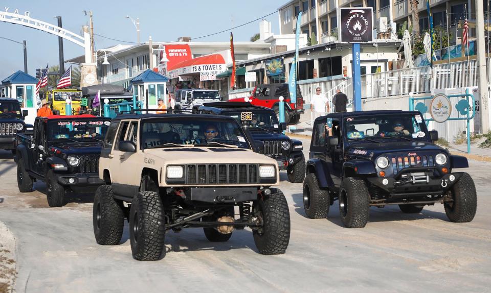 Jeeps begin to enter the International Speedway Boulevard approach for the "Jeep Beach Sweep." On the last day of event, drivers and their vehicles parade down the beach, picking up garbage as they go.