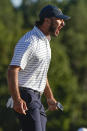 Max Homa celebrates winning the 18th hole during their fourball match at the Presidents Cup golf tournament at the Quail Hollow Club, Friday, Sept. 23, 2022, in Charlotte, N.C. (AP Photo/Chris Carlson)