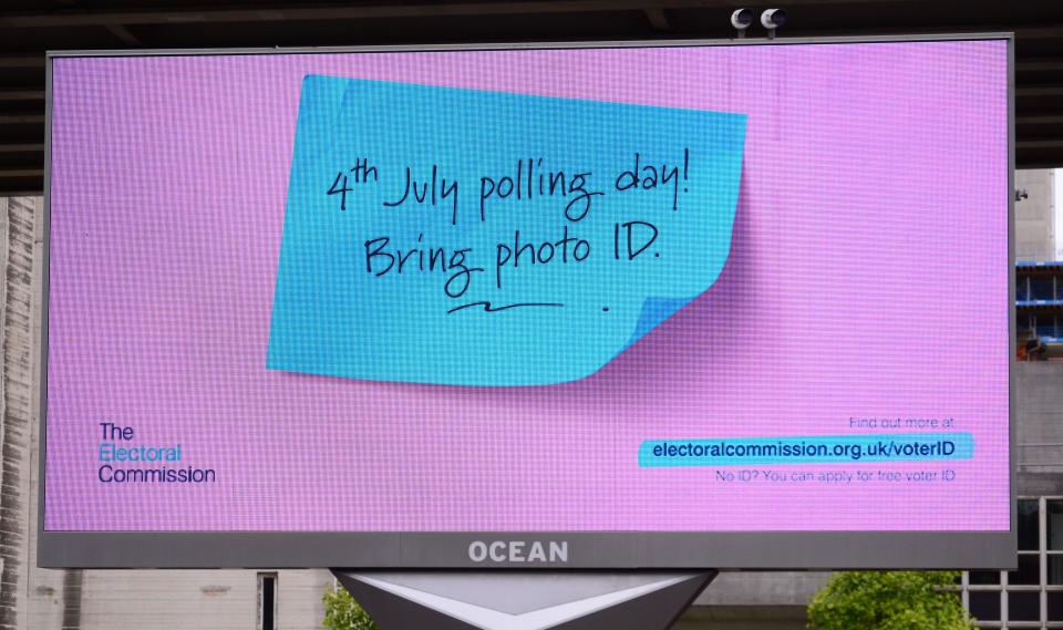 The Electoral Commission uses an electronic billboard in Manchester, UK, to inform people that voters in England will need to show photo ID to vote on July 4.