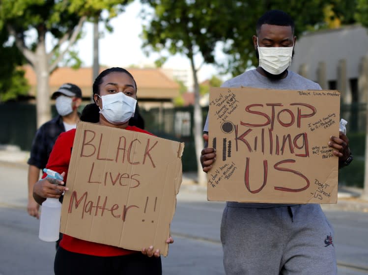 Protesters walk on Philadelphia St. during George Floyd/Black Lives Matter march through uptown Whittier on Sunday, May 31, 2020. About 500 people walked from city hall to Whittier Blvd. north, east on Hadley St.. and back to city hall. Many chanted Balck Lives Matter, I can't Breathe and other slogans related to the march.