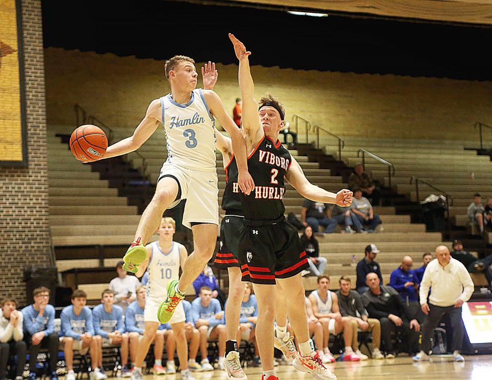 Hamlin’s Easton Neuendorf looks to pass the ball while Viborg-Hurley’s Devin Sayler defends during the second half of the Chargers’ 81-39 win on Saturday, Feb. 10, 2024 in the DWU/Culver’s Classic at the Corn Palace in Mitchell.