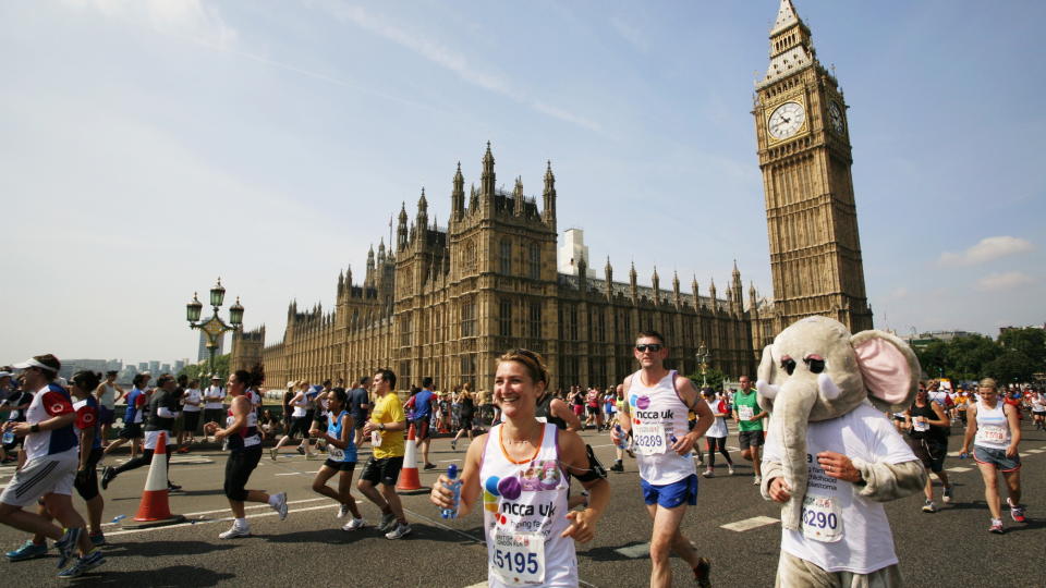  Fun runners competing in the London Marathon outside the Houses of Parliament. 