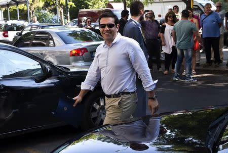 Greek Prime Minister Alexis Tsipras arrives for a ruling Syriza party political committee meeting at the party's headquarters in Athens, Greece July 27, 2015. REUTERS/Ronen Zvulun