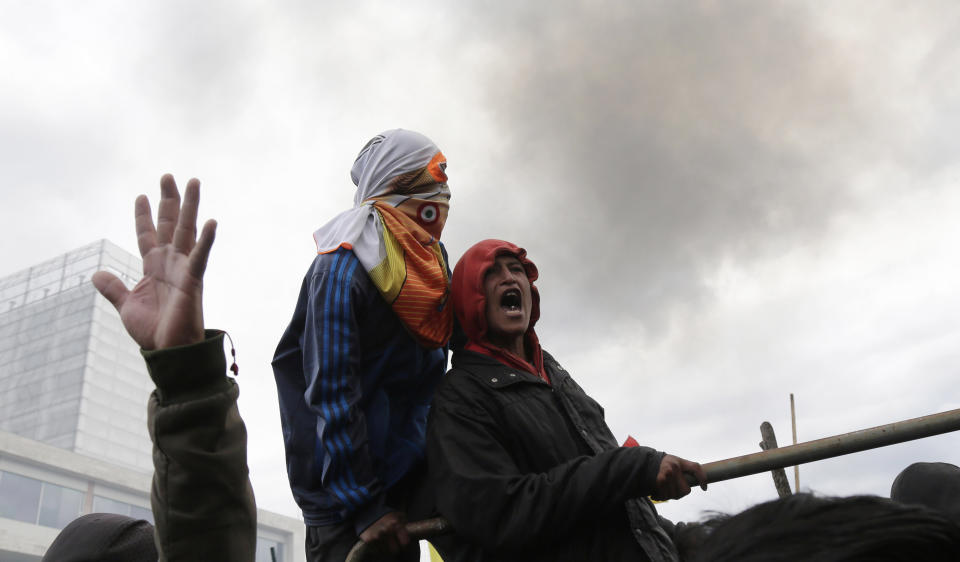 Anti-government protesters clash with police near the National Assembly in Quito, Ecuador, Tuesday, Oct. 8, 2019. Protests, which began when President Lenín Moreno’s decision to cut subsidies led to a sharp increase in fuel prices, has persisted for days, and clashes led the president to move his besieged administration out of Quito. (AP Photo/Dolores Ochoa)