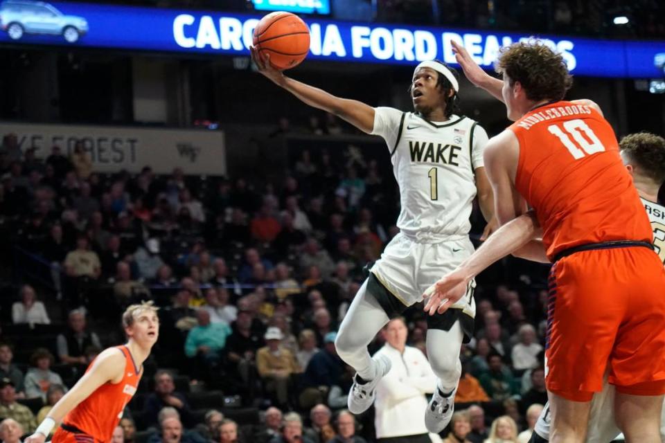 Wake Forest guard Tyree Appleby (1) drives past Clemson forward Ben Middlebrooks (10) during the first half of an NCAA college basketball game in Winston-Salem, N.C., Tuesday, Jan. 17, 2023. (AP Photo/Chuck Burton)