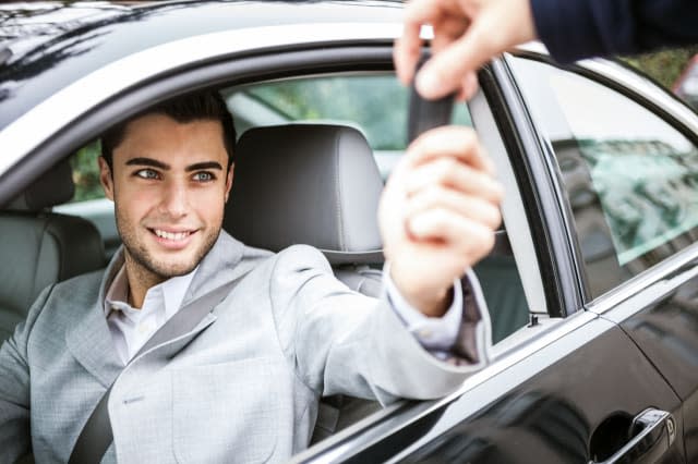 man taking car key