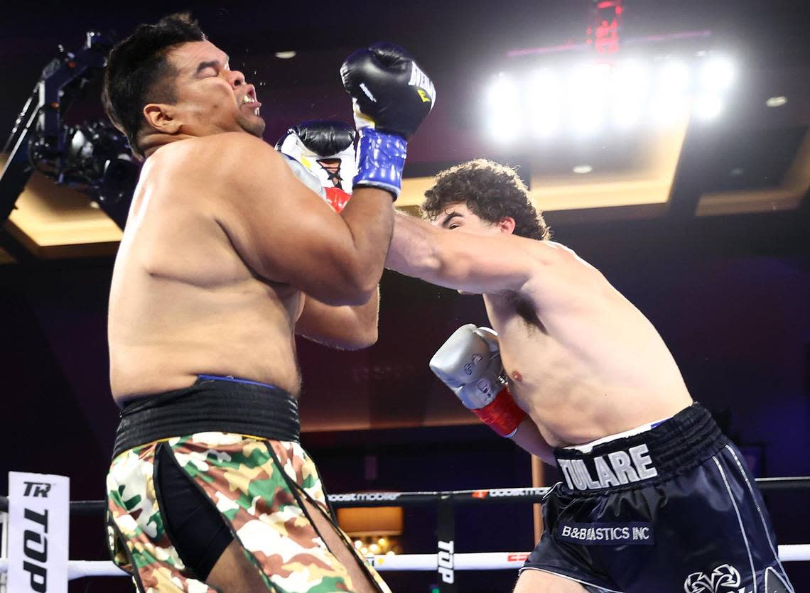 Roberto Zavala Jr (L) and Richard Torrez Jr (R) exchange punches during their heavyweight fight on July 15, 2022 in Temecula, California.