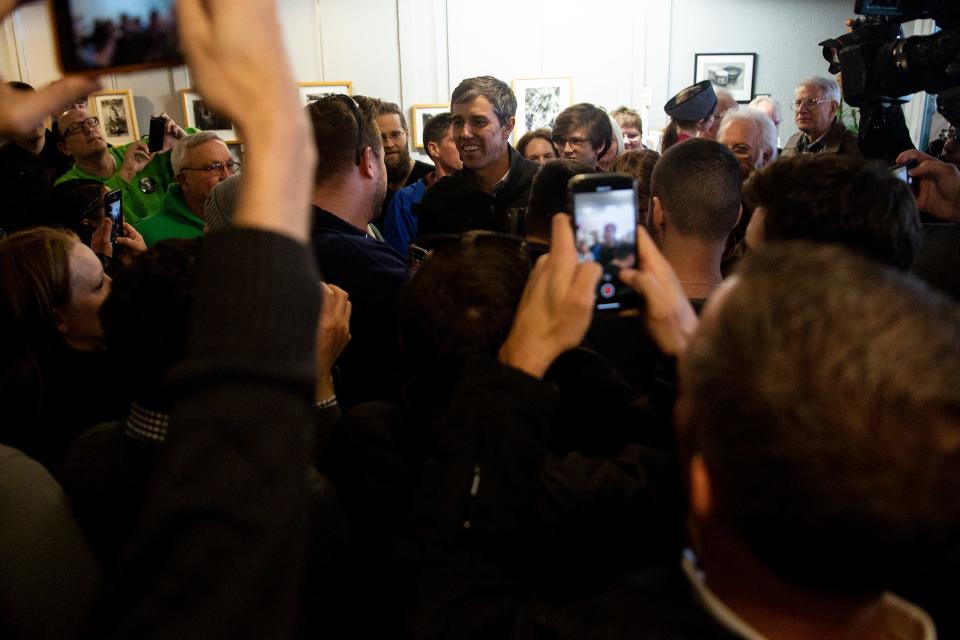 Beto O'Rourke, Democratic candidate for president, enters a crush of people gathered to see him on Friday, March 15, 2019, in Washington, Iowa. It was O'Rourke's first trip to Iowa after announcing his campaign.