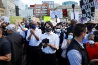 Canada's Prime Minister Justin Trudeau wears a mask as he takes part in a rally against the death in Minneapolis police custody of George Floyd, on Parliament Hill, in Ottawa