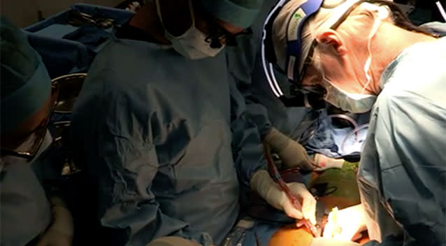 Dr Larbalestier performs surgery on Mr Fisher. Source: 7 News