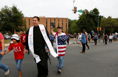 Participants of "Charlottesville to D.C: The March to Confront White Supremacy" begin a ten-day trek to the nation's capital from Charlottesville, Virginia, U.S. August 28, 2017. REUTERS/Julia Rendleman