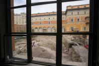 People walk in the excavation site of the ancient Roman emperor Nero's theater, 1st century AD, during a press preview, in Rome, Wednesday, July 26, 2023. The ruins of Nero's Theater, an imperial theater referred to ancient Roman texts but never found, have been discovered under the garden of the future Four Season's Hotel, steps from the Vatican, after excavating the walled garden of the Palazzo della Rovere since 2020, as part of planned renovations on the Renaissance building. (AP Photo/Andrew Medichini)