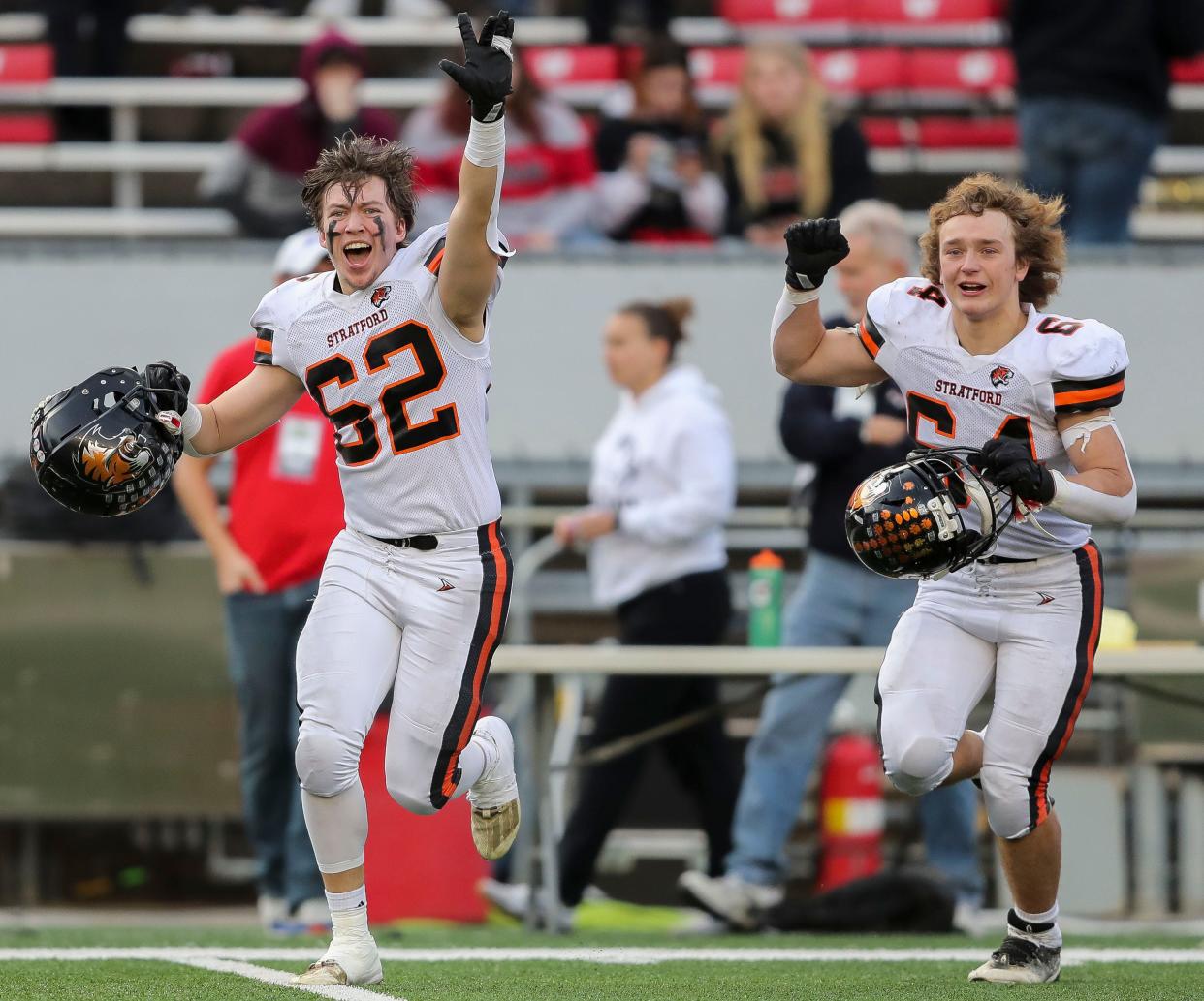 Stratford High School's Riley Kroening (62) and Kaleb Krummel (64) celebrate after going through the handshake line after the WIAA Division 6 state championship football game on Thursday, November 16, 2023, at Camp Randall Stadium in Madison, Wis. Stratford won the game, 10-7, on a 32-yard field goal on the final play of the game.
Tork Mason/USA TODAY NETWORK-Wisconsin