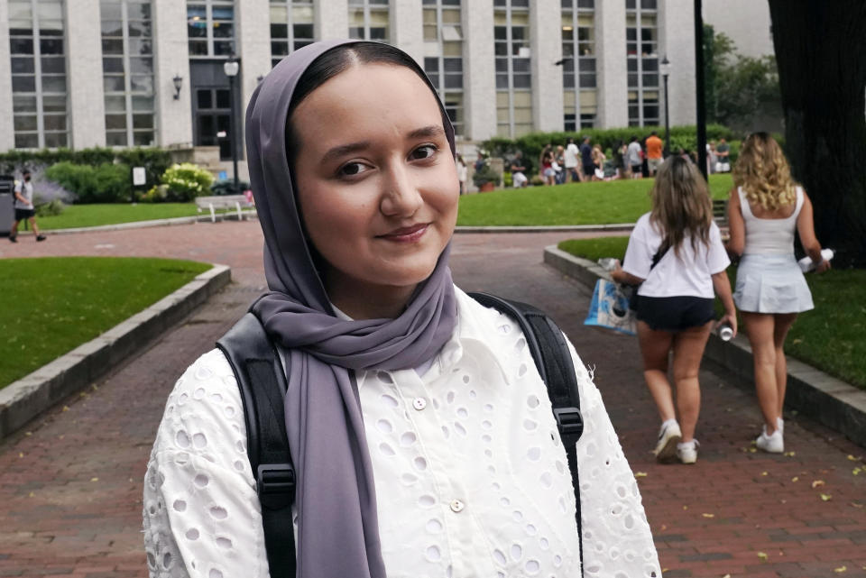 Northeastern University student Mashal Aziz poses on campus, Friday, July 21, 2023, in Boston. Aziz was just months away from graduating from college in Afghanistan when she found herself rushing to the airport to leave the country as the Taliban swept into power. Universities and colleges across the U.S. have scrambled to find ways to help students, like Aziz, to continue their education. (AP Photo/Charles Krupa)