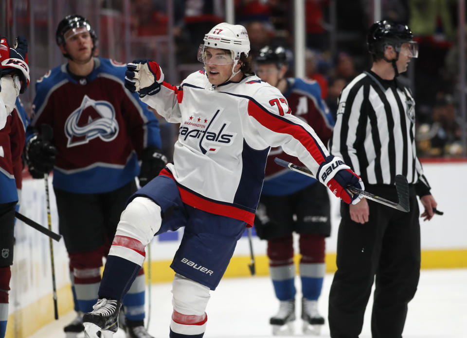 Washington Capitals right wing T.J. Oshie celebrates as he passes the team box after scoring the go-ahead goal against the Colorado Avalanche during the third period of an NHL hockey game Thursday, Feb. 13, 2020, in Denver. The Capitals won 3-2. (AP Photo/David Zalubowski)