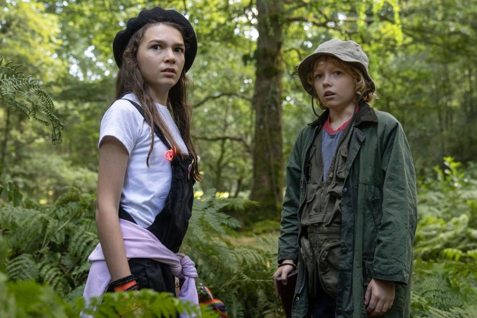 Brooklynn Prince and Christian Convery standing in the woods