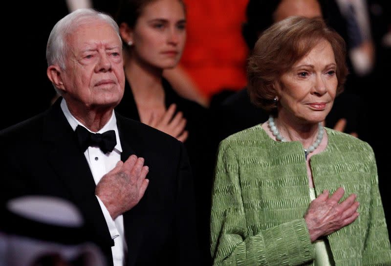 FILE PHOTO: Former U.S. President Carter and his wife attend the "All Together Now - A Celebration of Service" in Washington