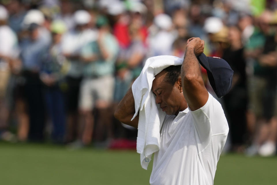 Tiger Woods wipes his face on the second hole during the first round of the Masters golf tournament at Augusta National Golf Club on Thursday, April 6, 2023, in Augusta, Ga. (AP Photo/Mark Baker)