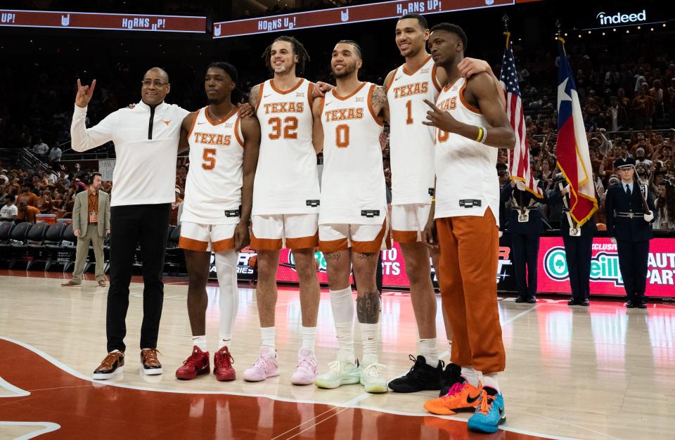 Texas Head Coach Rodney Terry, left, stand with seniors Marcus Carr (5), Christian Bishop (32), Timmy Allen (0), Dylan Disu (1) and Sir’Jabari Rice (10) during a senior celebration ahead of the Longhorns’ game against the University of Kansas Jayhawks at the Moody Center in <a class="link " href="https://sports.yahoo.com/ncaaw/teams/austin-college/" data-i13n="sec:content-canvas;subsec:anchor_text;elm:context_link" data-ylk="slk:Austin;sec:content-canvas;subsec:anchor_text;elm:context_link;itc:0">Austin</a>,