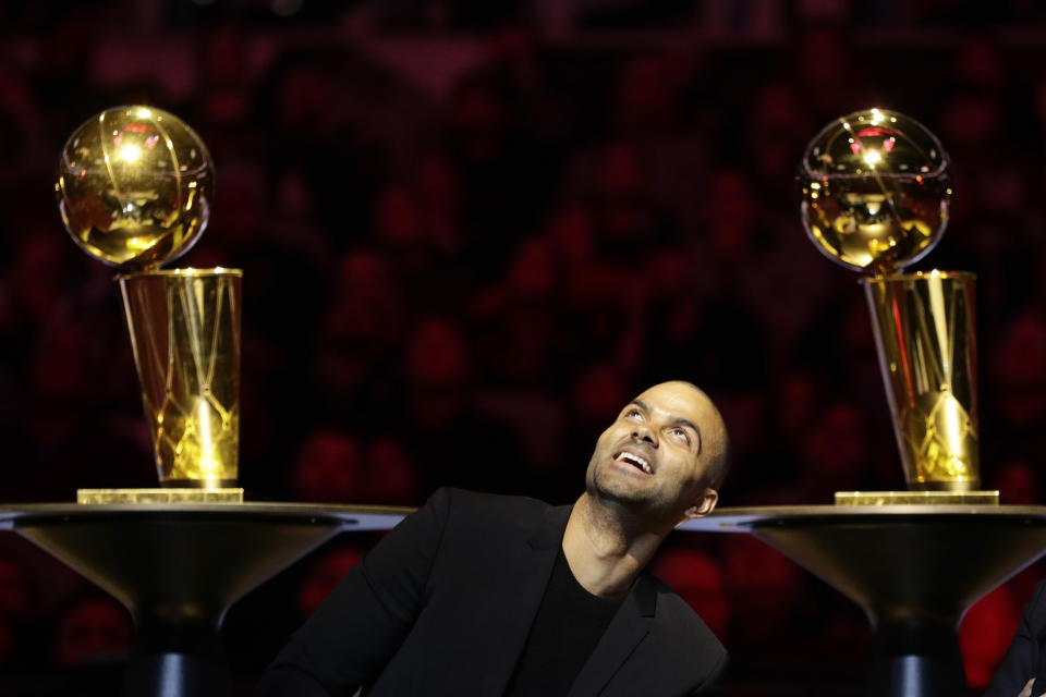 Former San Antonio Spurs guard Tony Parker looks up during his retirement ceremony after the team's NBA basketball game against the Memphis Grizzlies in San Antonio, Monday, Nov. 11, 2019. (AP Photo/Eric Gay)