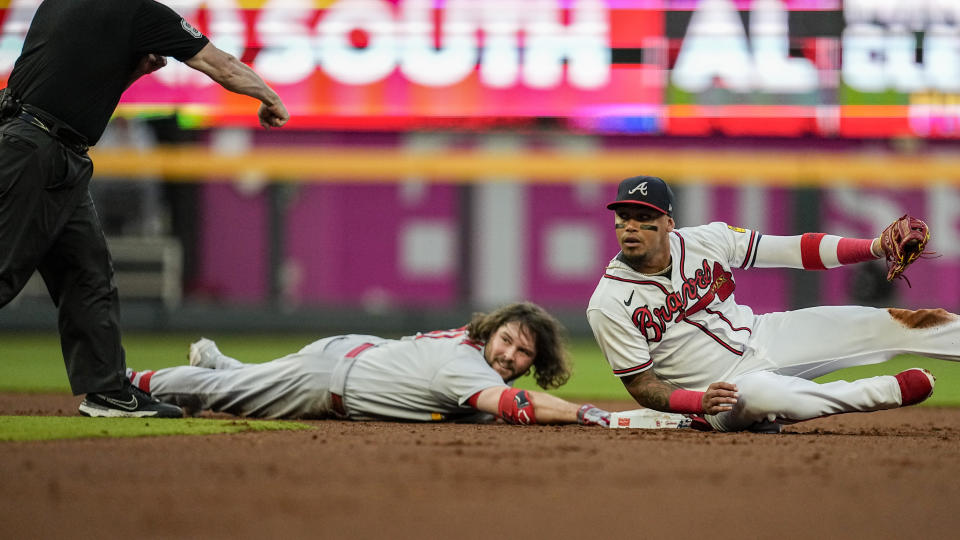 St. Louis Cardinals left fielder Alec Burleson (41) is tagged out at second base against Atlanta Braves shortstop Orlando Arcia (11) during the first inning of a baseball game, Wednesday, Sept. 6, 2023, in Atlanta. (AP Photo/Mike Stewart)