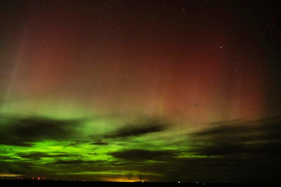 An aurora borealis, also known as the northern lights, is seen in the night sky in the early morning hours of April 24, near Washtucna, Washington. A solar storm forecast for Thursday is expected to give skygazers in more than a dozen American states a chance to glimpse the northern lights.