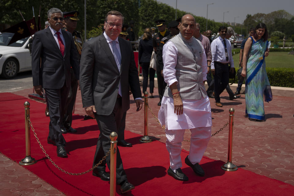 German Defense Minister Boris Pistorius walks with Indian Defense Minister Rajnath Singh in New Delhi, India, Tuesday, June 6, 2023. (AP Photo/Altaf Qadri)