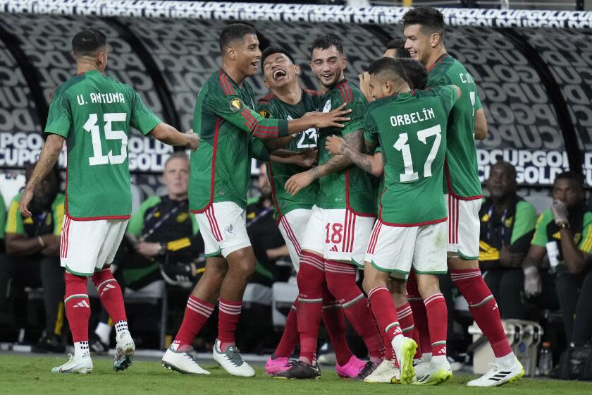 Mexico players celebrate after Luis Chavez (18) scored against Jamaica during the first half of a CONCACAF Gold Cup semifinals soccer match Wednesday, July 12, 2023, in Las Vegas. (AP Photo/John Locher)