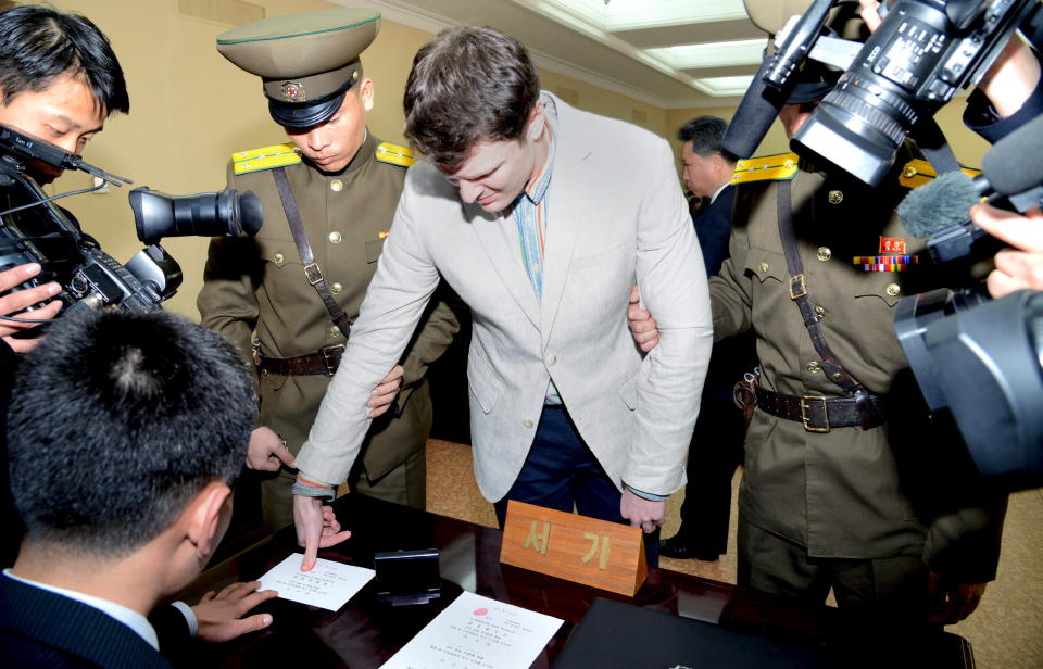 Otto Warmbier has his fingerprints taken at North Korea's top court, in this photo released by North Korea's Korean Central News Agency (KCNA) in Pyongyang on March 16, 2016.&nbsp;