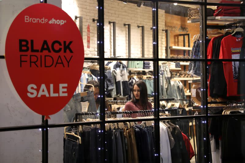 A woman is seen inside a store at a mall during the Black Friday sales in Caracas