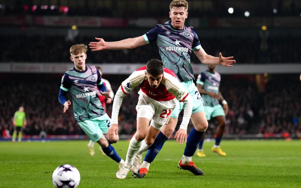 Arsenal's Kai Havertz (left) is challenged by Brentford's Nathan Collins