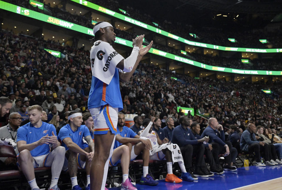 Oct 12, 2023; Montreal, Quebec, CAN; Oklahoma City Thunder guard Shai Gilgeous-Alexander (2) cheers his team on during the fourth quarter against the Detroit Pistons at the Bell Centre. Mandatory Credit: Eric Bolte-USA TODAY Sports