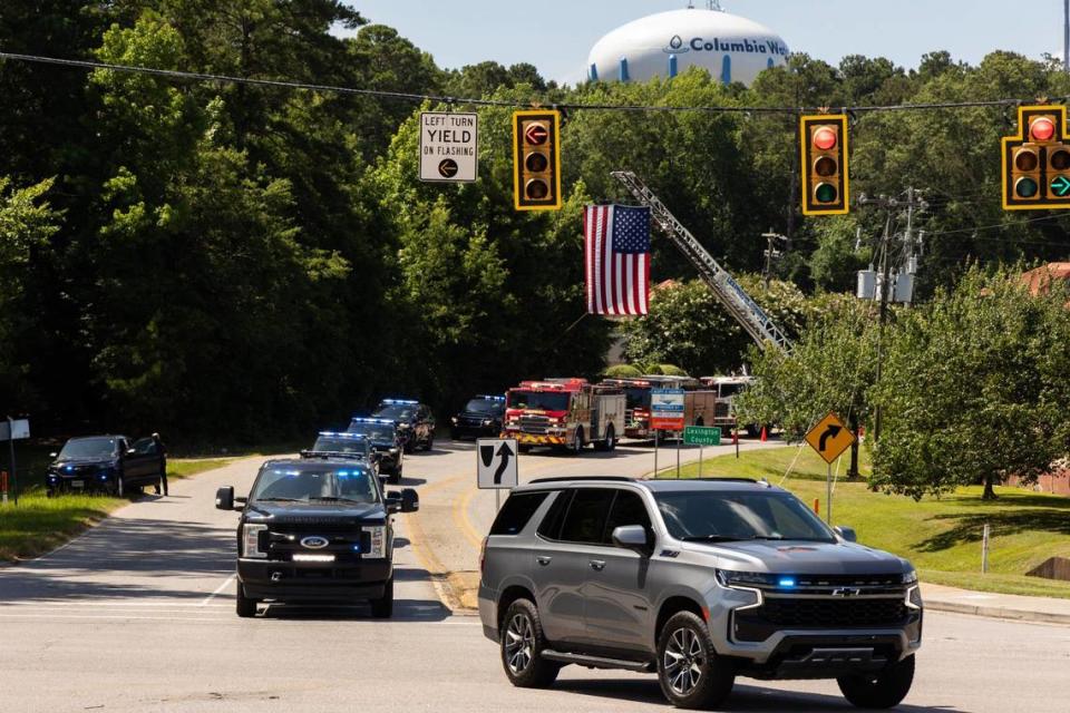 Deputies and officers with the Richland County Sheriff’s Department and other local public safety departments take part in a funeral procession for the sheriff’s department’s K9 Wick on Thursday, June 20, 2024. The Richland County Sheriff’s Department says Wick was struck by a vehicle early Thursday, June 20, and died at the scene.