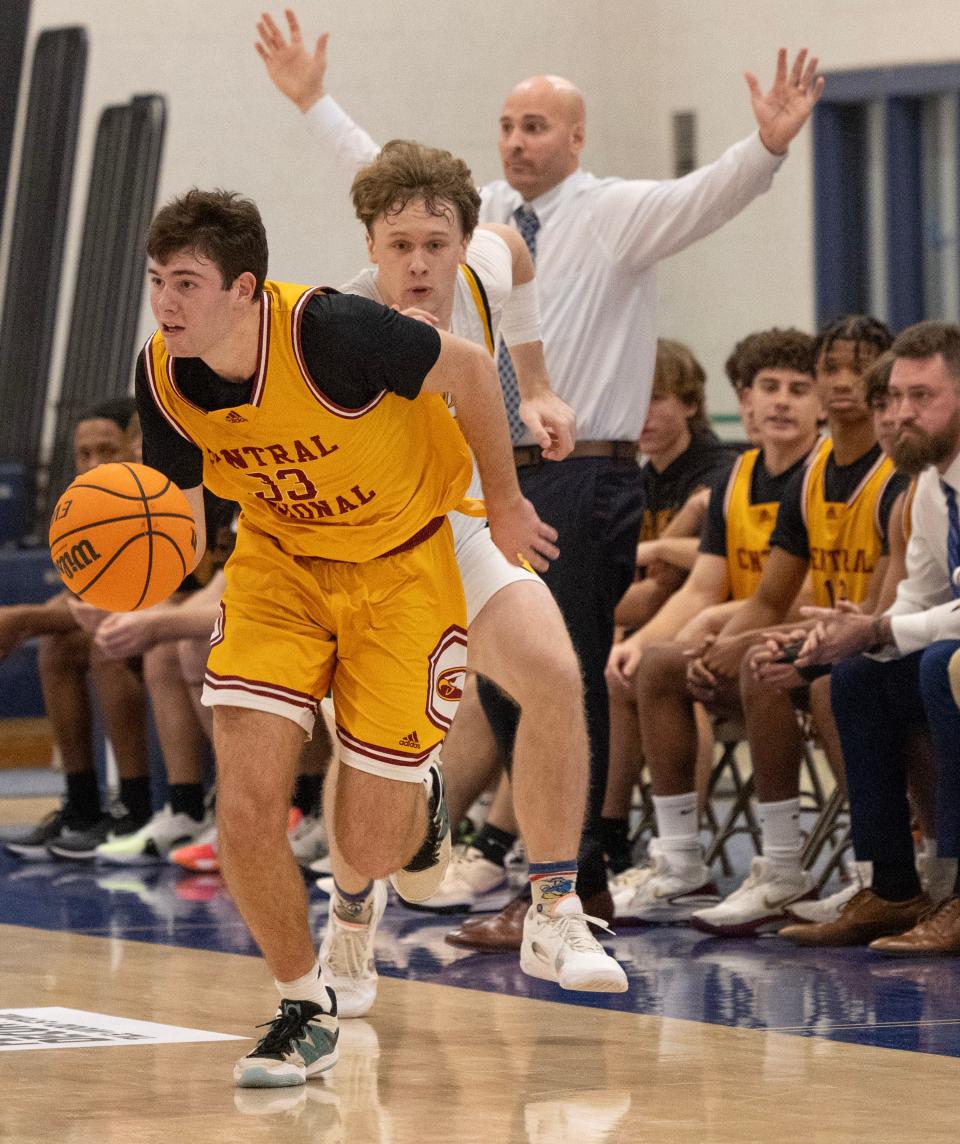 Central’s Miles Chevalier grabs a loose ball and heads down towards his basket. Central Regional Boys handles St. John Vianney in 2023 WOBM Christmas Tournament opening round in Toms 
River on December 26, 2023.