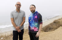 Author Neil Strauss, left, and Incubus guitarist Mike Einziger, of the podcast "To Live and Die in LA," pose for a portrait on Thursday, June 17, 2021, in Malibu, Calif. Strauss is back with a second season of his podcast, focusing on the 2017 disappearance of Elaine Park, a 20-year-old woman last seen in Calabasas, California. (Photo by Willy Sanjuan/Invision/AP)